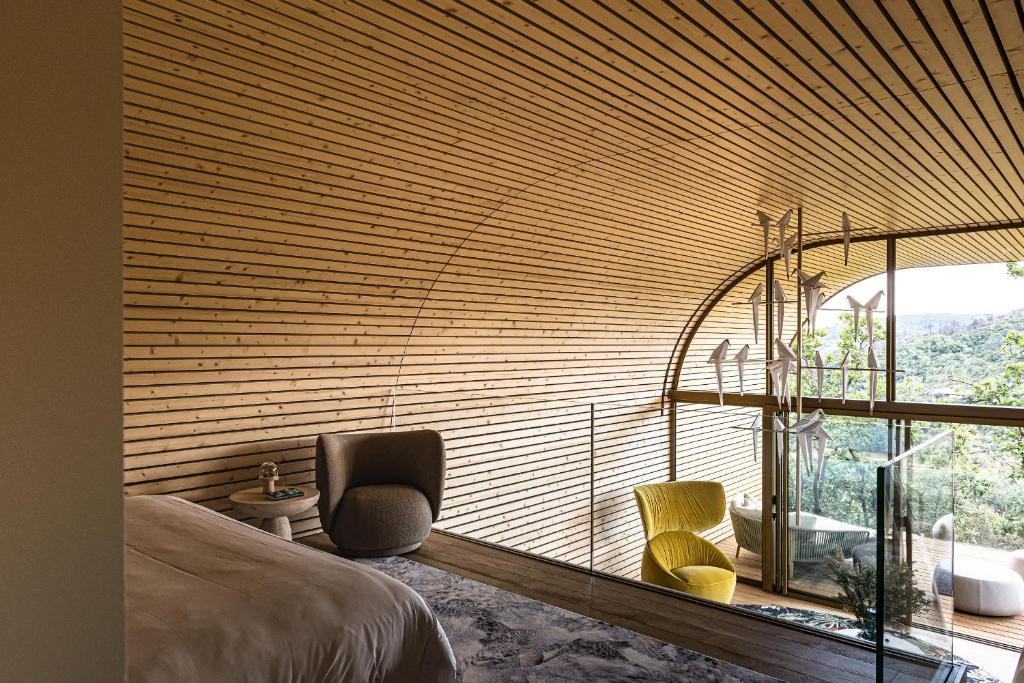 chambre sur mezzanine maison en bois design Souki Lodges & Spa chambre sur mezzanine maison en bois design Souki Lodges & Spa