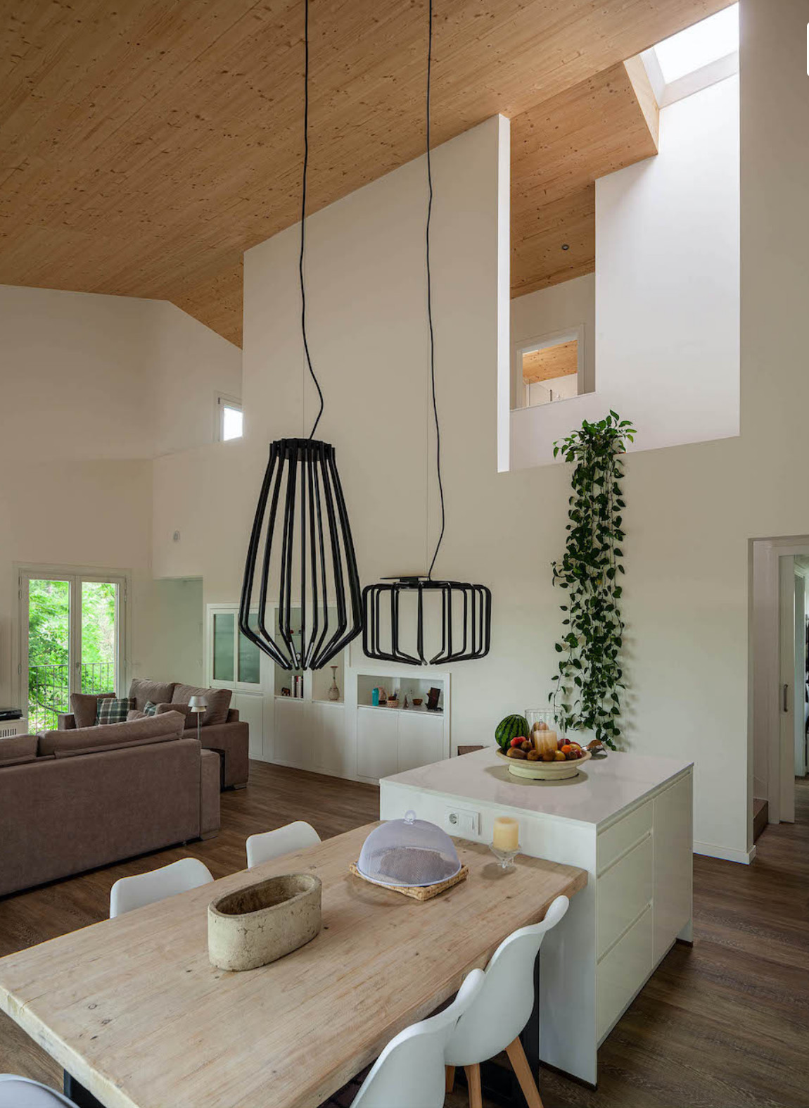 salon double hauteur maison préfabriquée et biopassive en bois House Habitat
