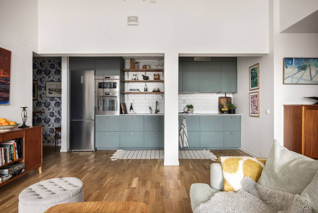 cuisine ouverte verte et salon appartement 100m2 décoration scandinave