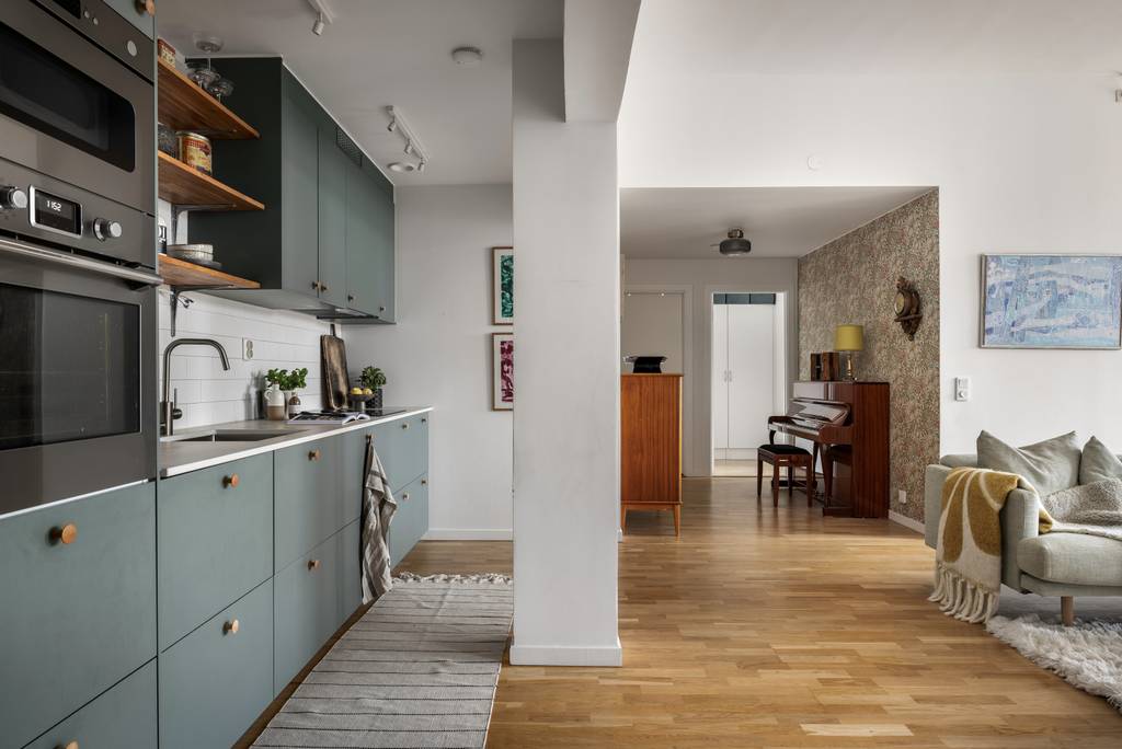 cuisine ouverte verte et salon appartement 100m2 décoration scandinave