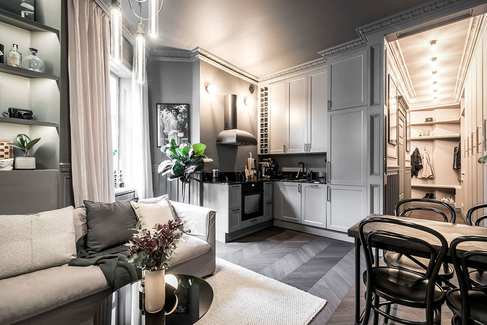 cuisine ouverte dans salon avec moulures anciennes décoration grise scandinave et contemporaine deux-pièces 39m2