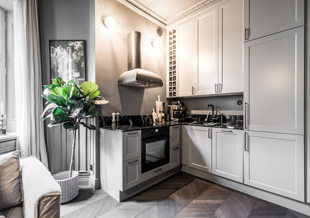 cuisine ouverte dans salon avec moulures anciennes décoration grise scandinave et contemporaine deux-pièces 39m2