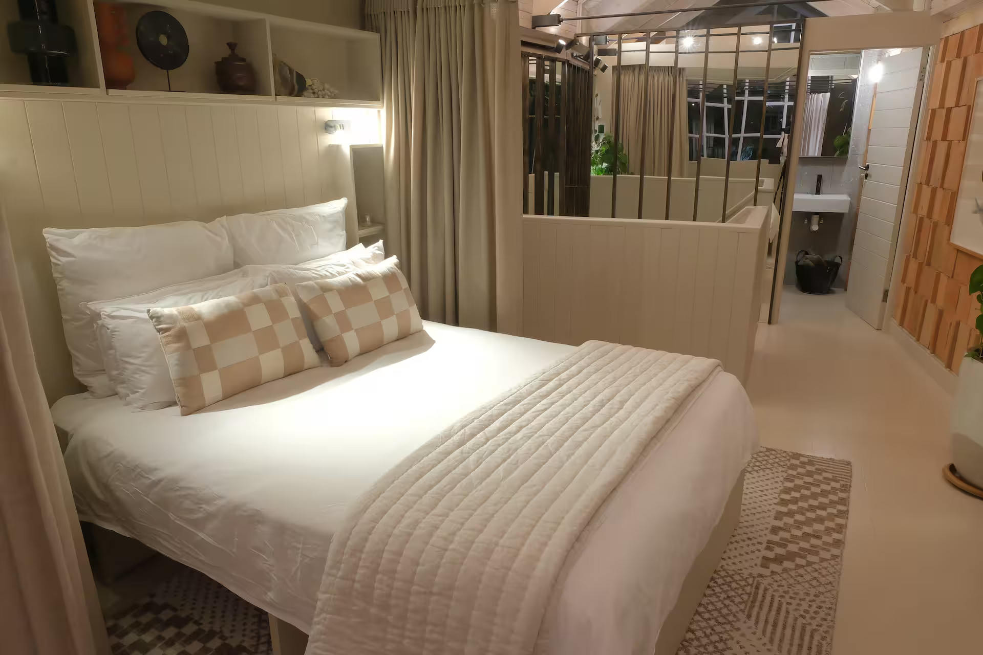 bedroom with semi open bathroom