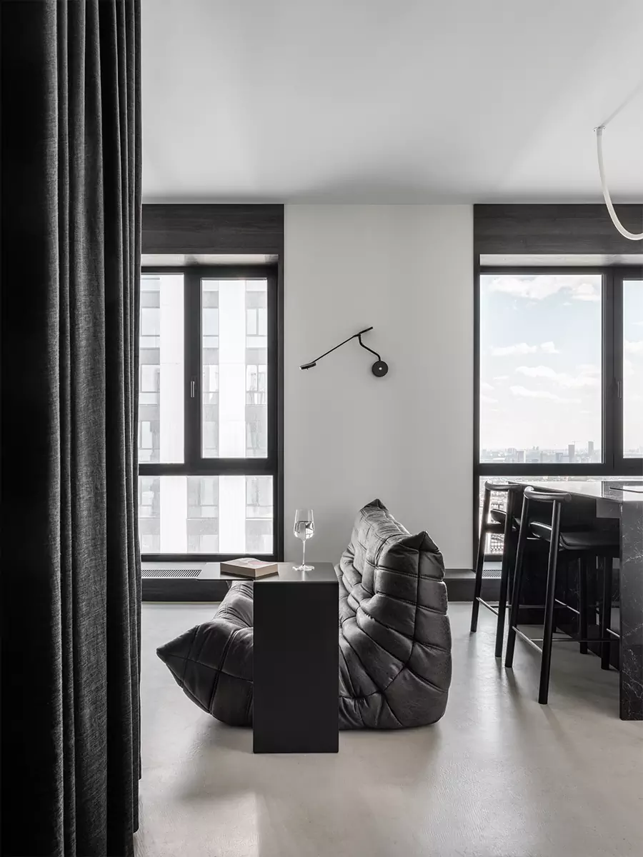 salon et cuisine ouverte petit appartement studio 35m2 noir et blanc design