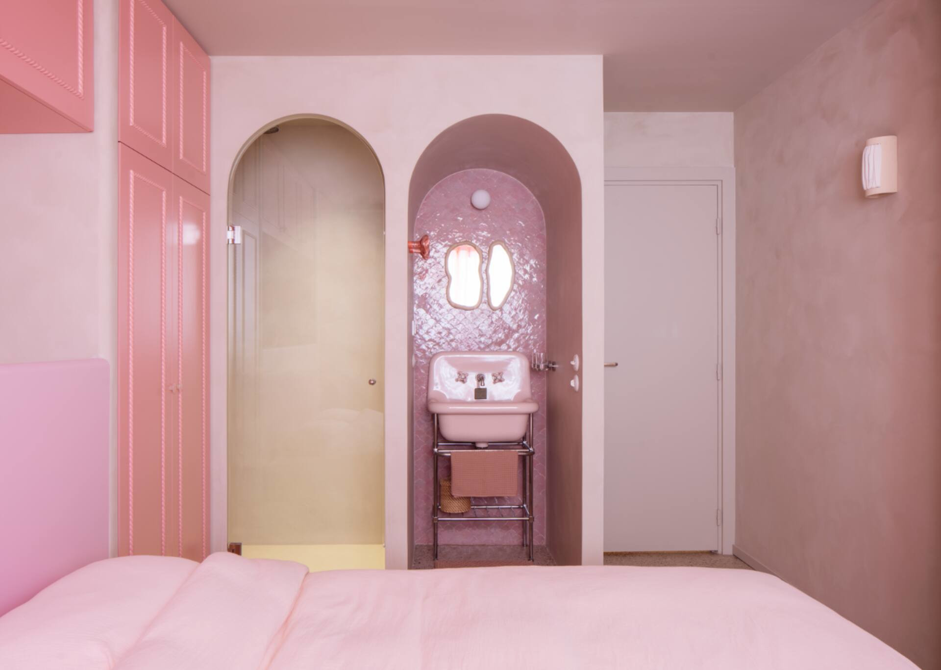 pink bedroom with retro style open bathroom