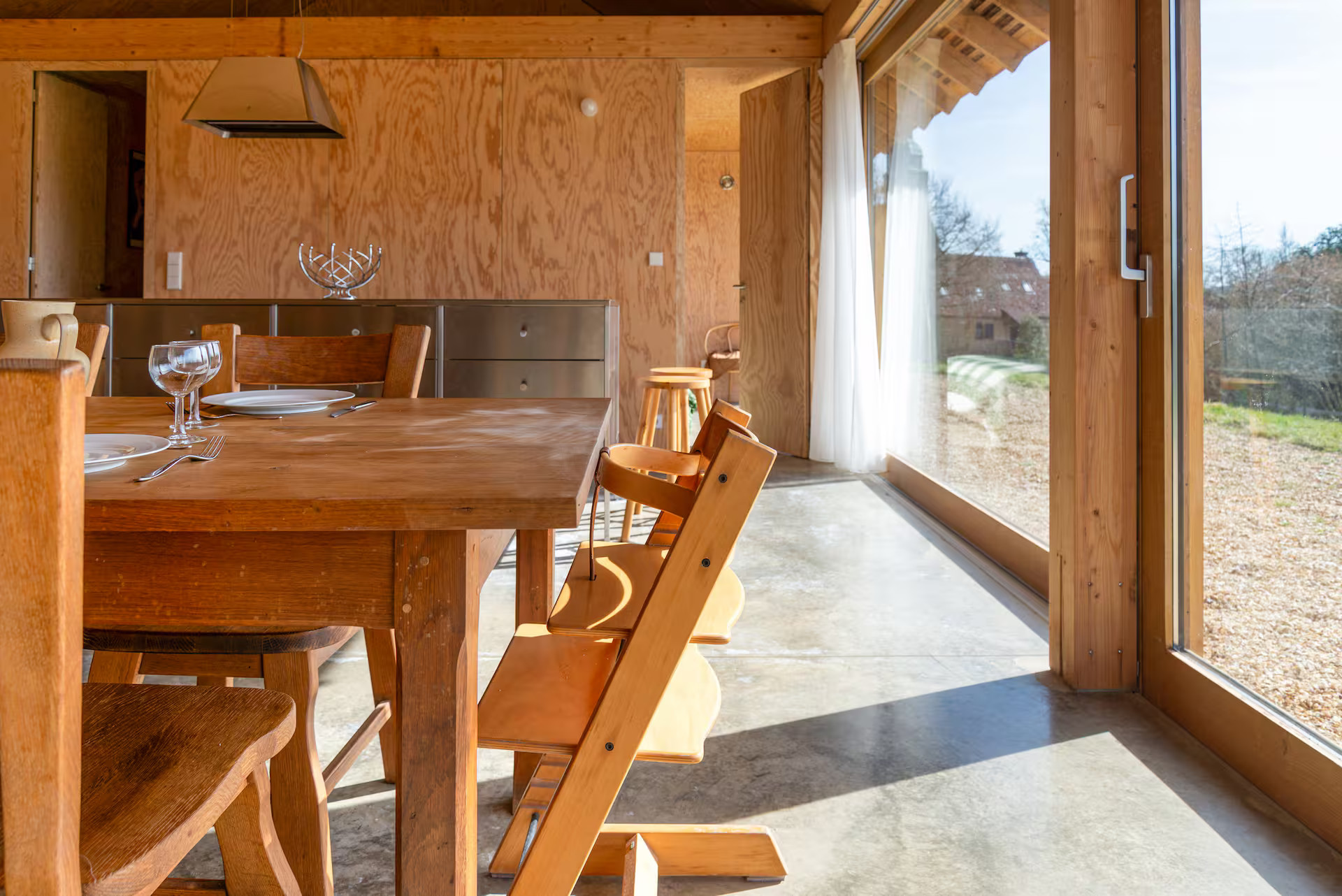 dining room and inox kitchen architect wooden house in the Perche France dining room and inox kitchen architect wooden house in the Perche France