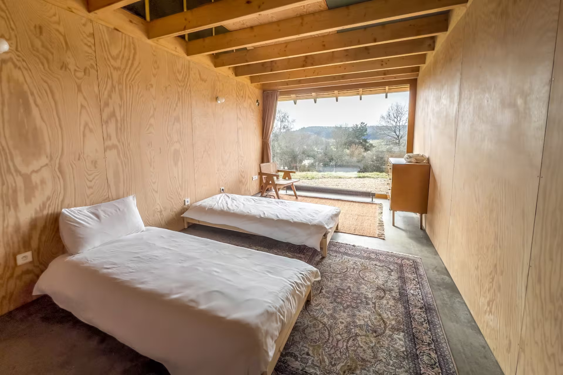 bedroom with two beds beams wood walls bay window bedroom with two beds beams wood walls bay window