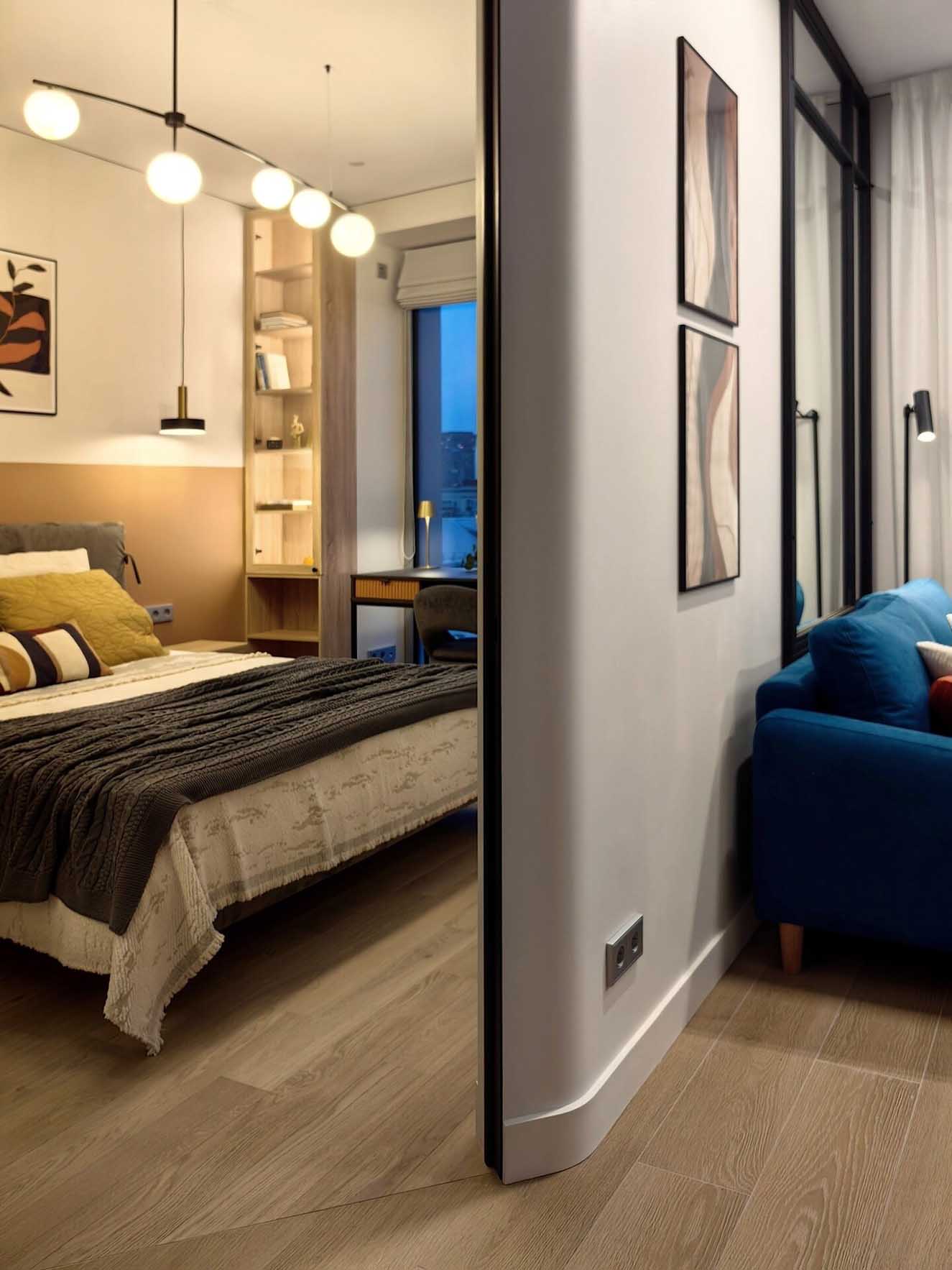 salon avec canapé bleu et chambre décoration contemporaine deux-pièces 34m2 salon avec canapé bleu et chambre décoration contemporaine deux-pièces 34m2