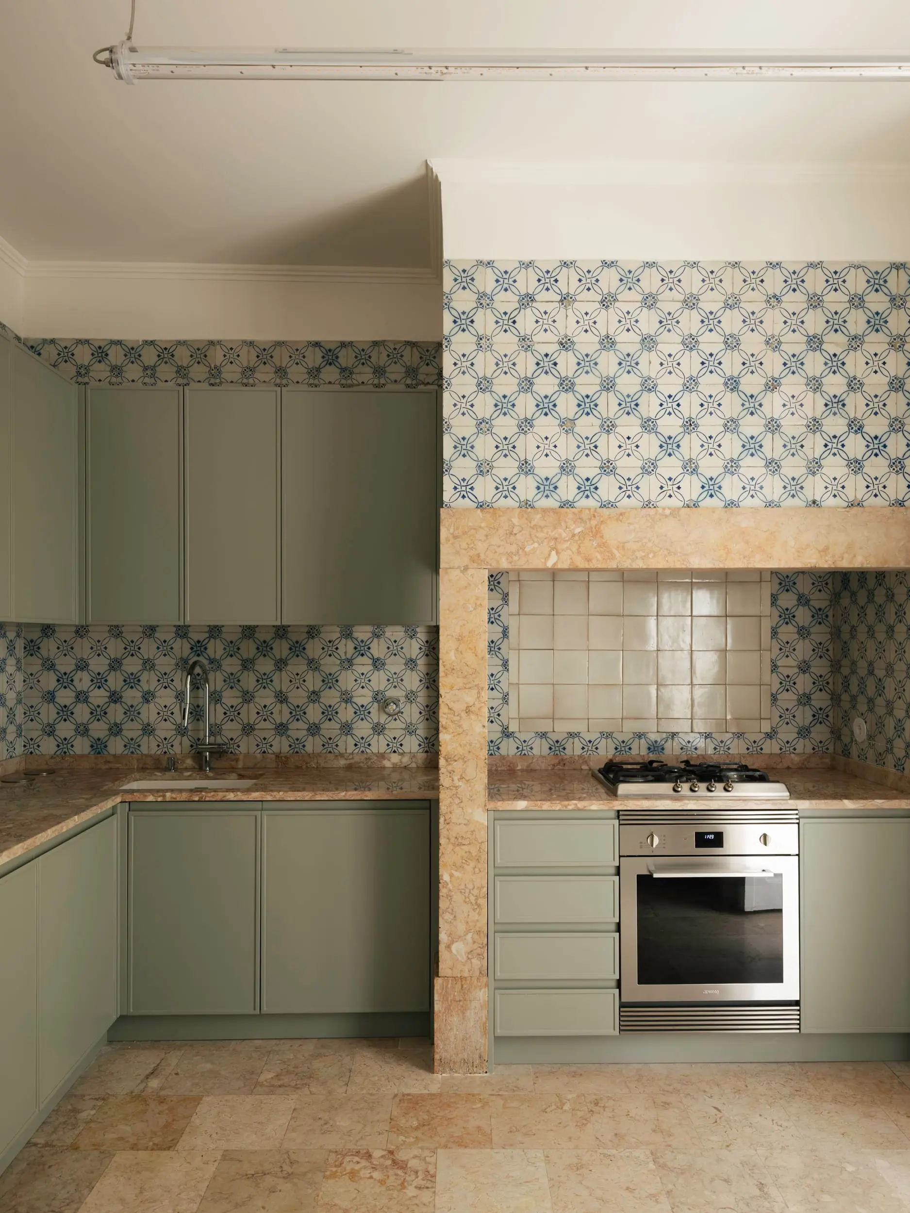 green kitchen with azulejos vintage apartment in Lisbon with refreshing garder green kitchen with azulejos vintage apartment in Lisbon with refreshing garder