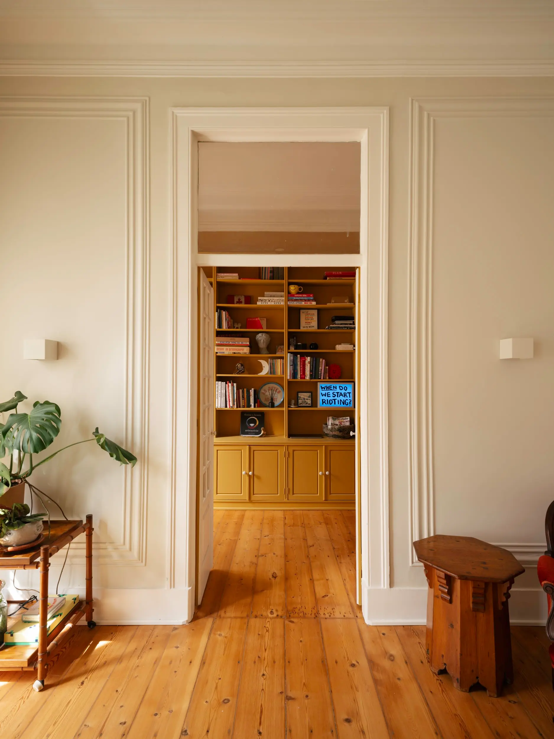 living room with yellow bookcase vintage apartment in Lisbon with refreshing garden living room with yellow bookcase vintage apartment in Lisbon with refreshing garden