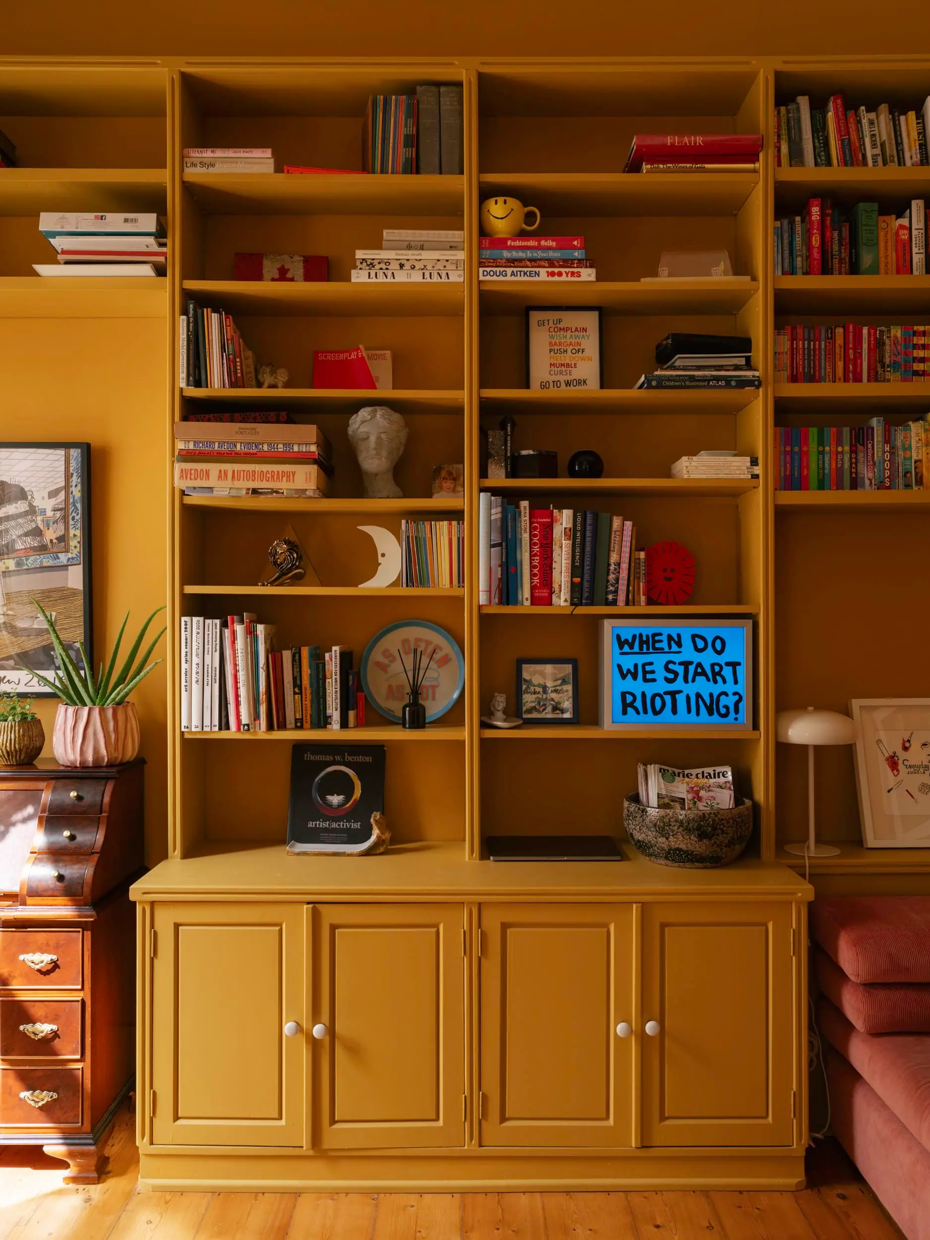 living room with yellow bookcase vintage apartment in Lisbon with refreshing garden living room with yellow bookcase vintage apartment in Lisbon with refreshing garden