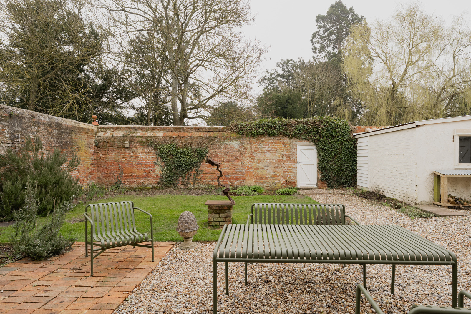 garden with bricks walls renovated 18th-century house in the English countryside garden with bricks walls renovated 18th-century house in the English countryside