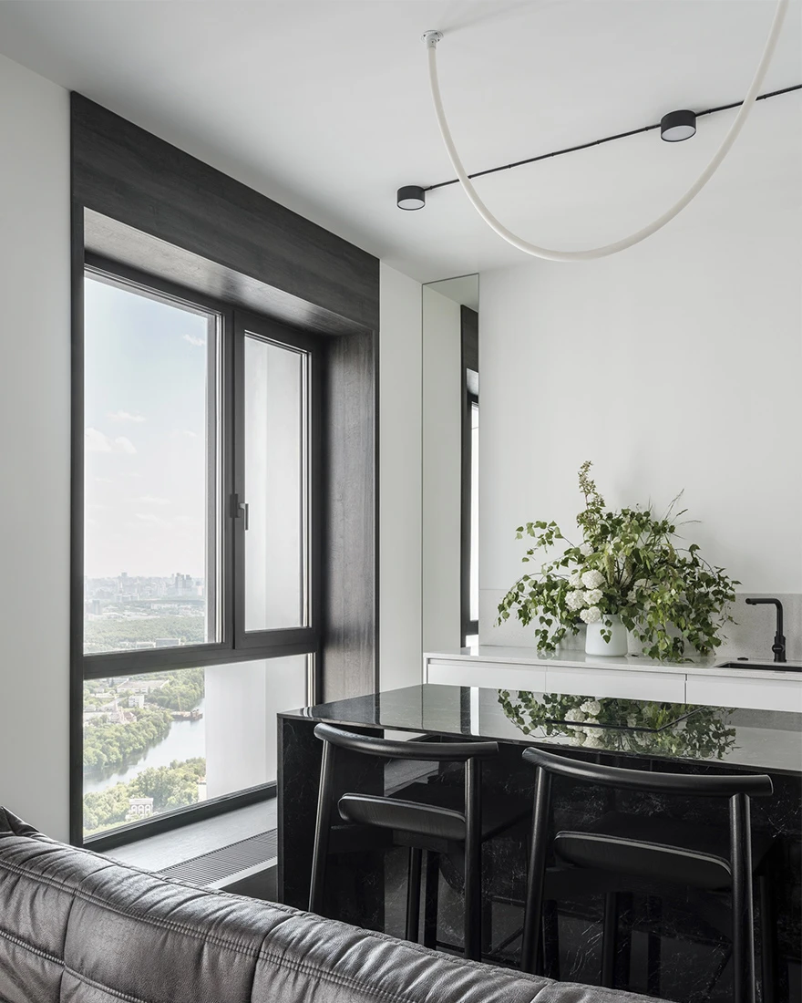 salon et cuisine ouverte petit appartement studio 35m2 noir et blanc design
