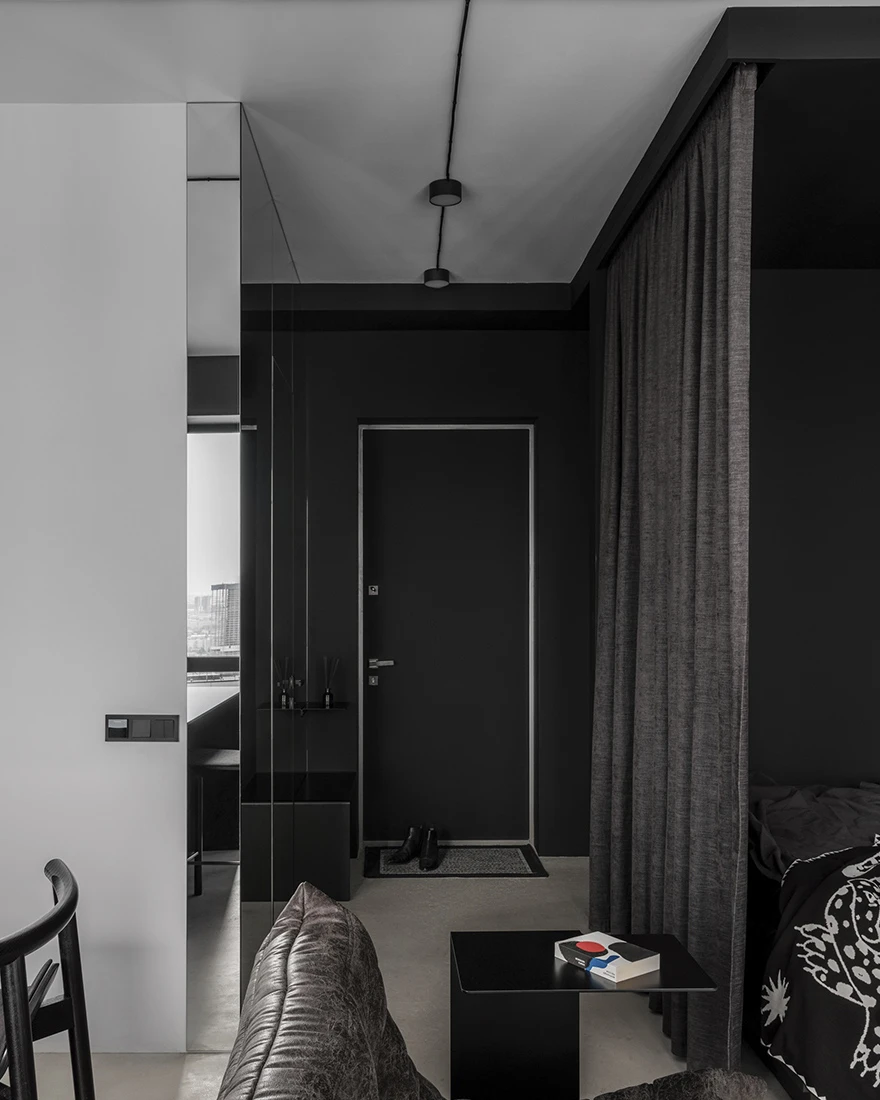 salon avec chambre alcôve petit appartement studio 35m2 noir et blanc design