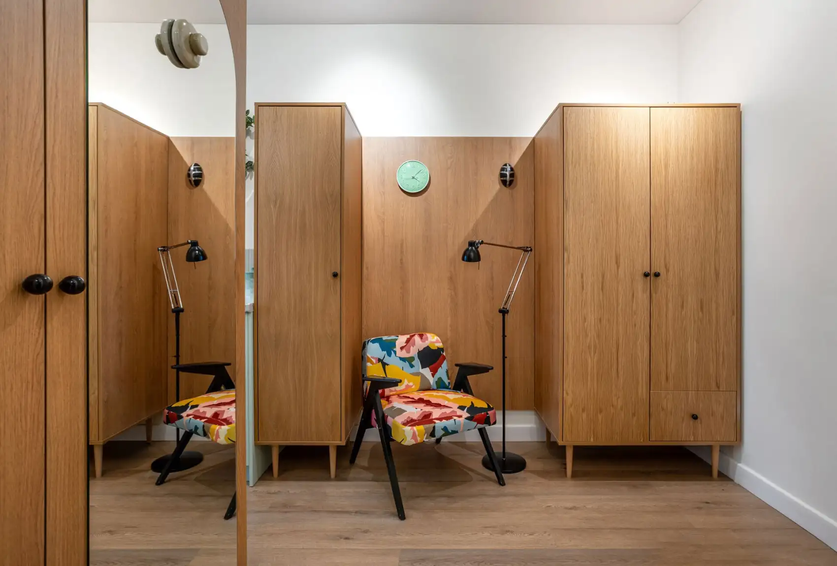 entryway with cupboards and armchair 