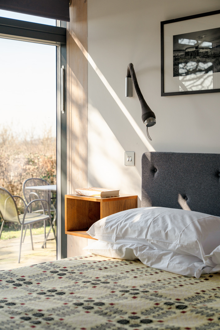 bedroom minimalist decor concrete floor Welsh home