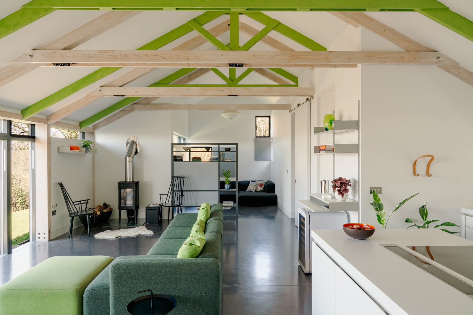 open kitchen and living room concrete floor bay windows contemporary house in Wales "The chicken shed"