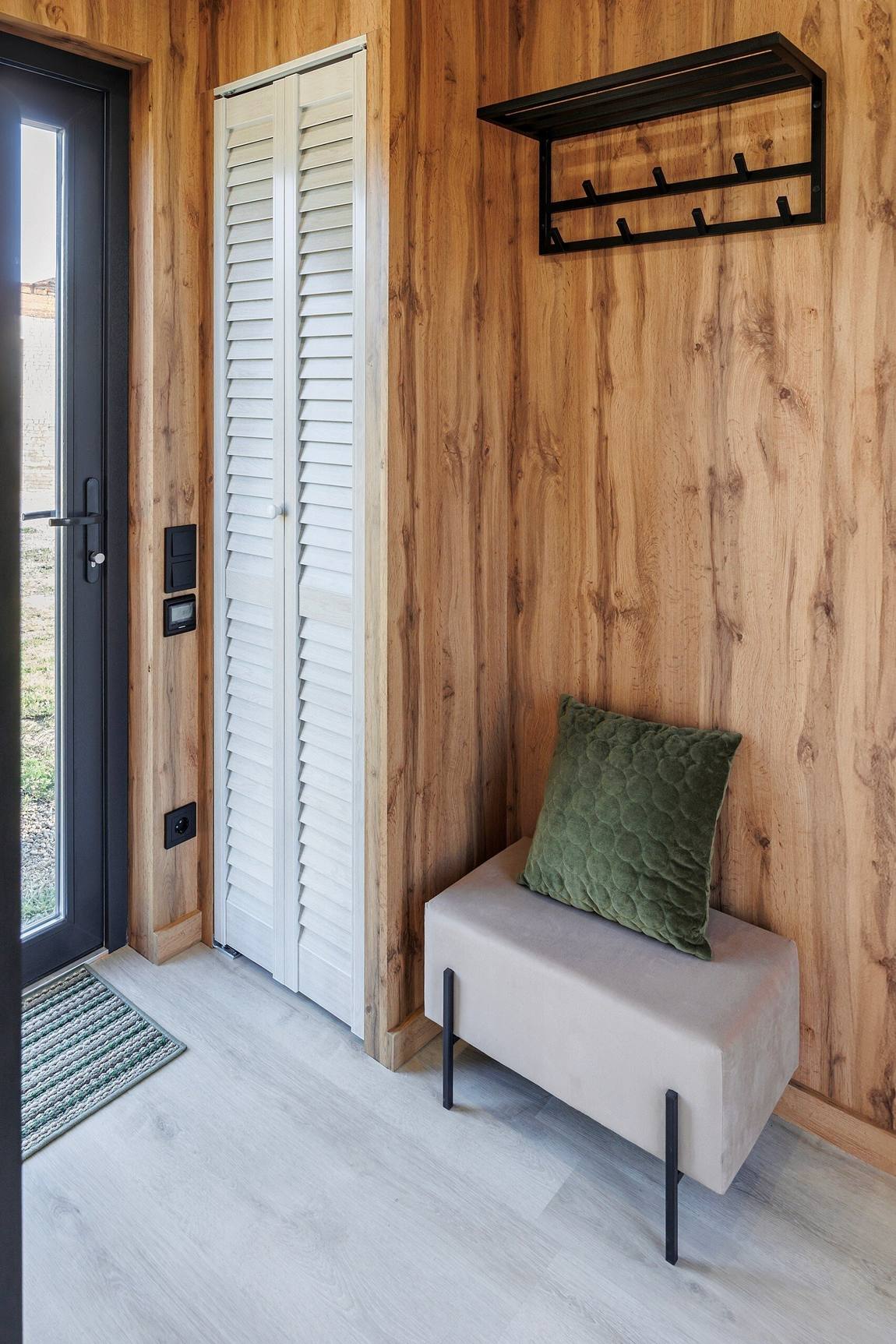 wooden wall with cupboard tiny house entrance wooden wall with cupboard tiny house entrance