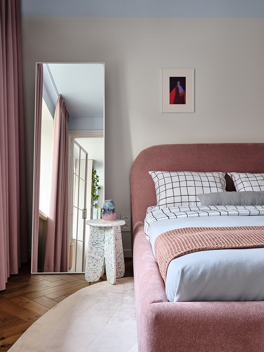 white and pink bedroom with mirror