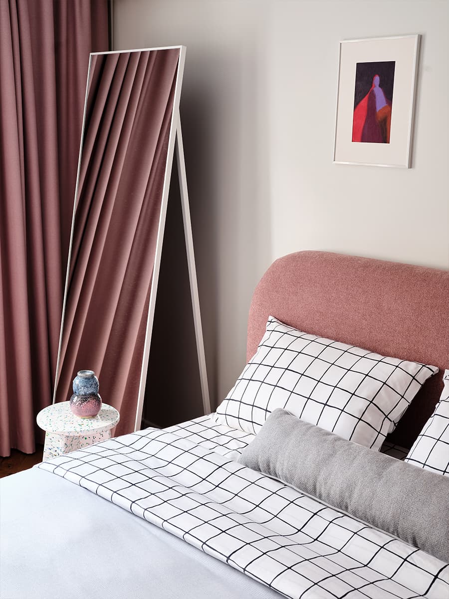 white and pink bedroom with mirror