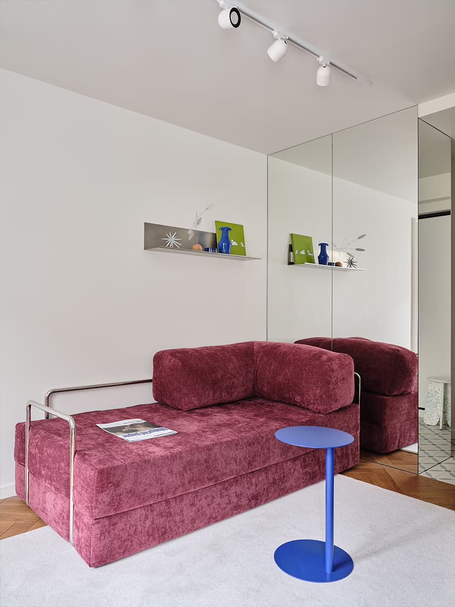 living room with pink sofa and mirror 38sqm apartment contemporary decor
