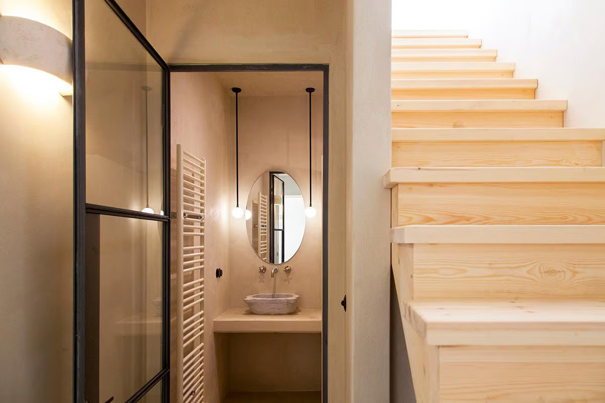 rustic chic bathroom with industrial glass door