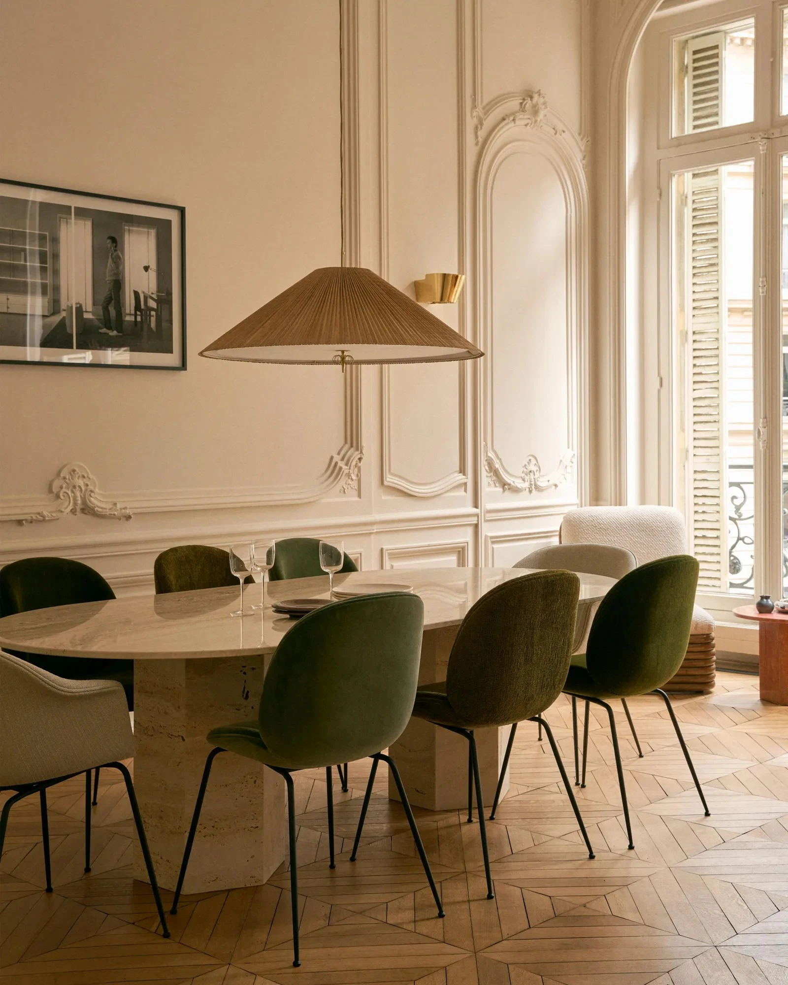 dining room with period mouldings Haussmann-style apartment in Paris by Gubi