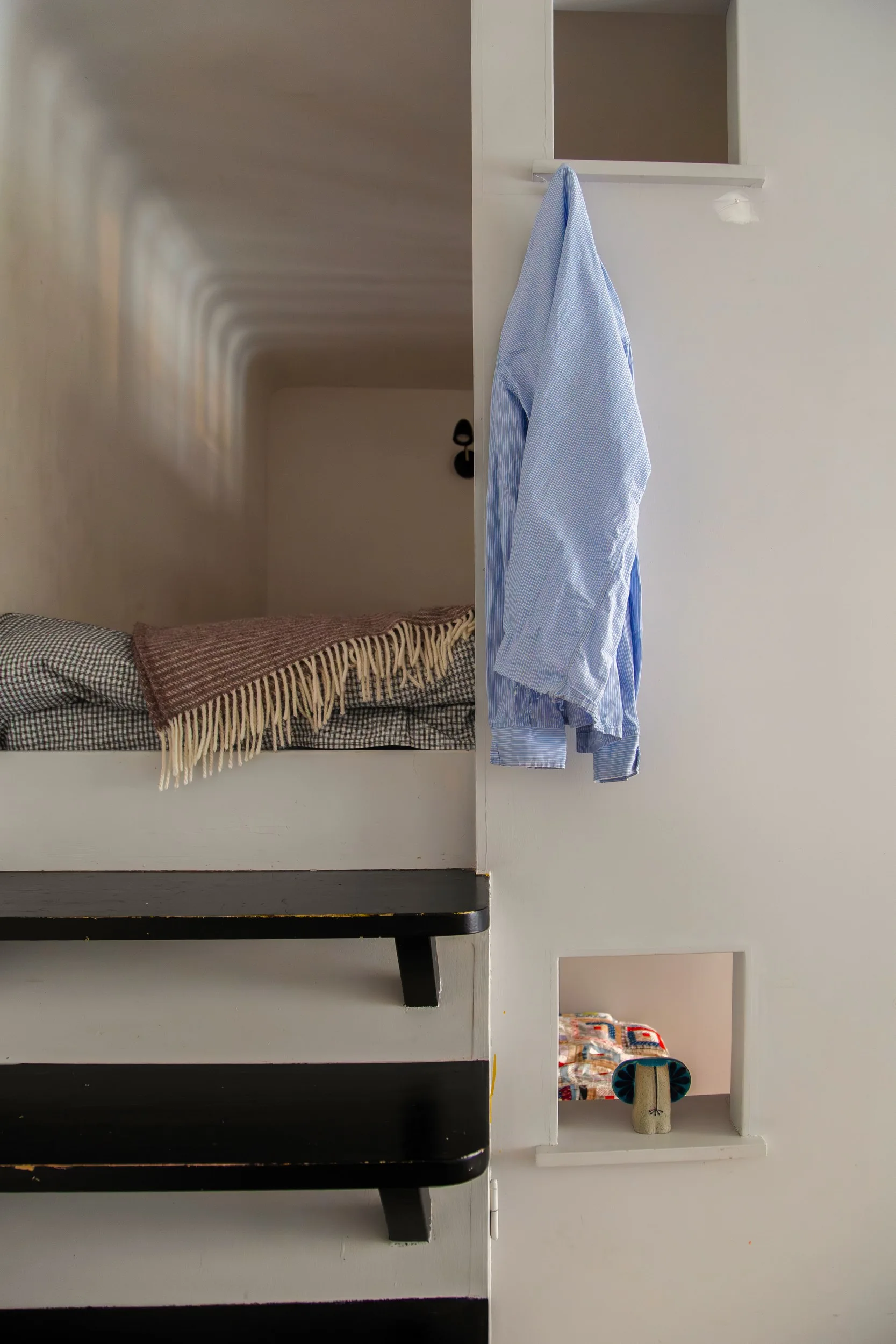 small bedroom on a mezzanine