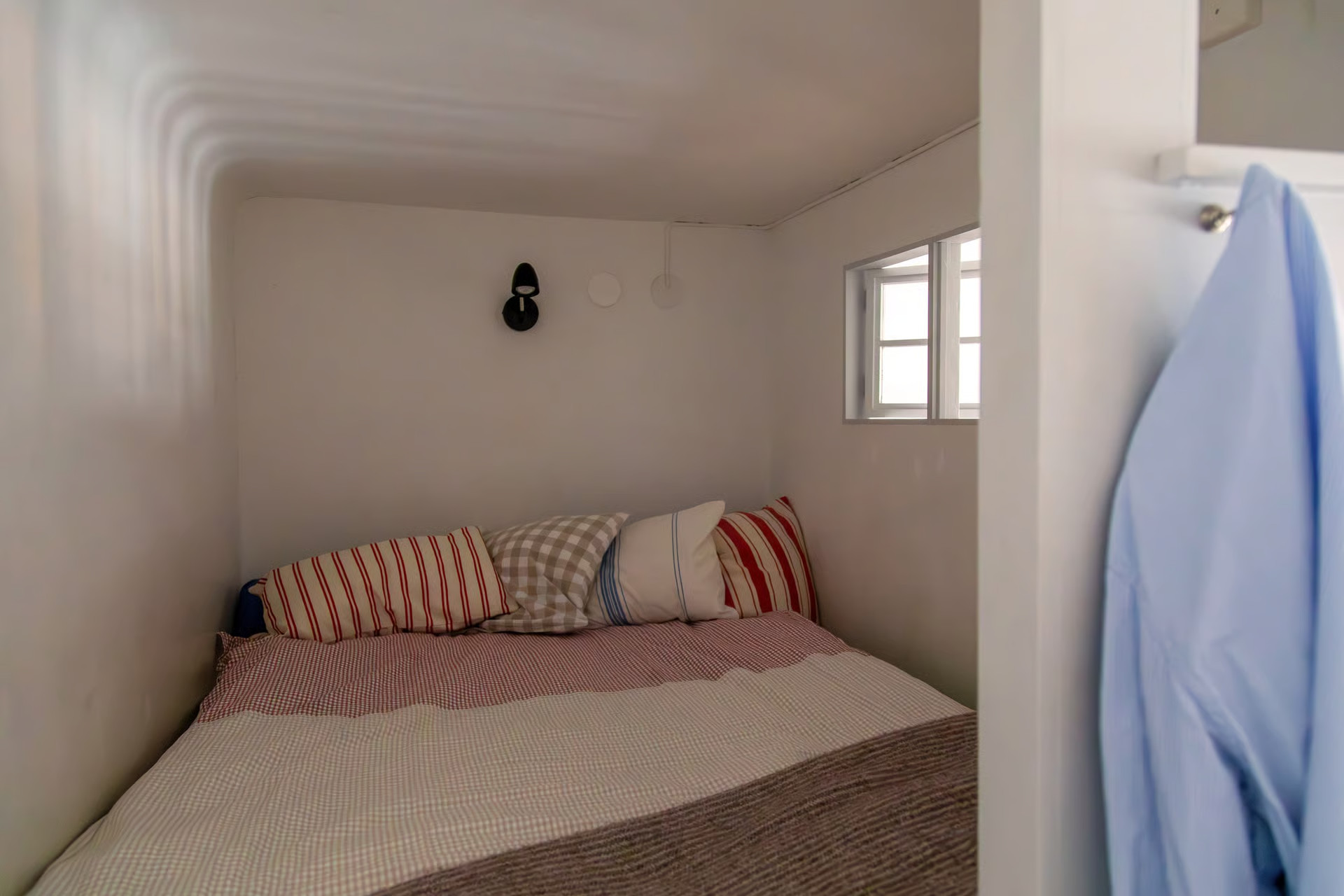 small bedroom on a mezzanine
