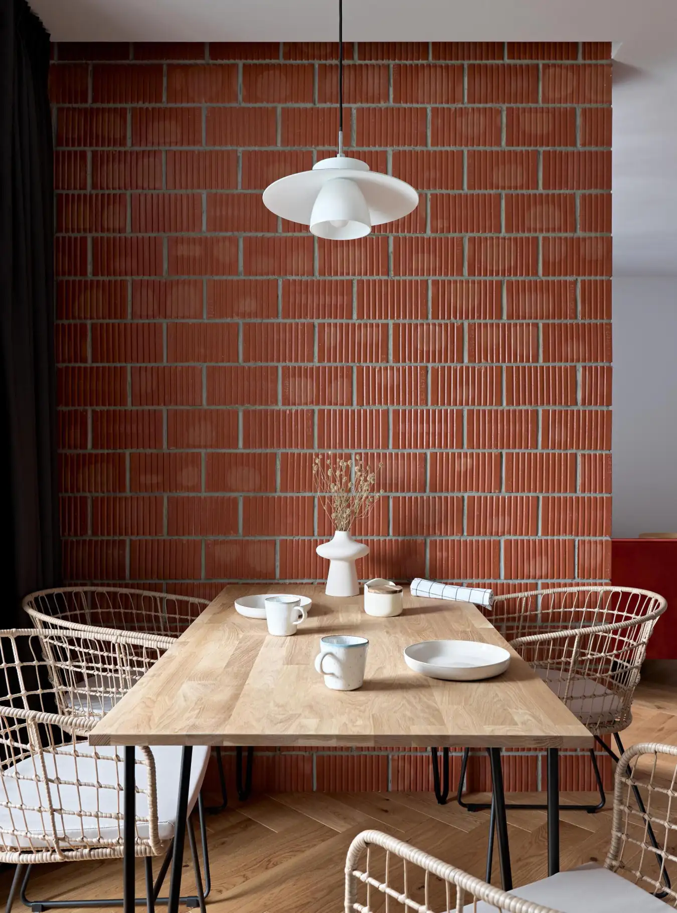 dining room with brick wall small modern apartment with IKEA furniture