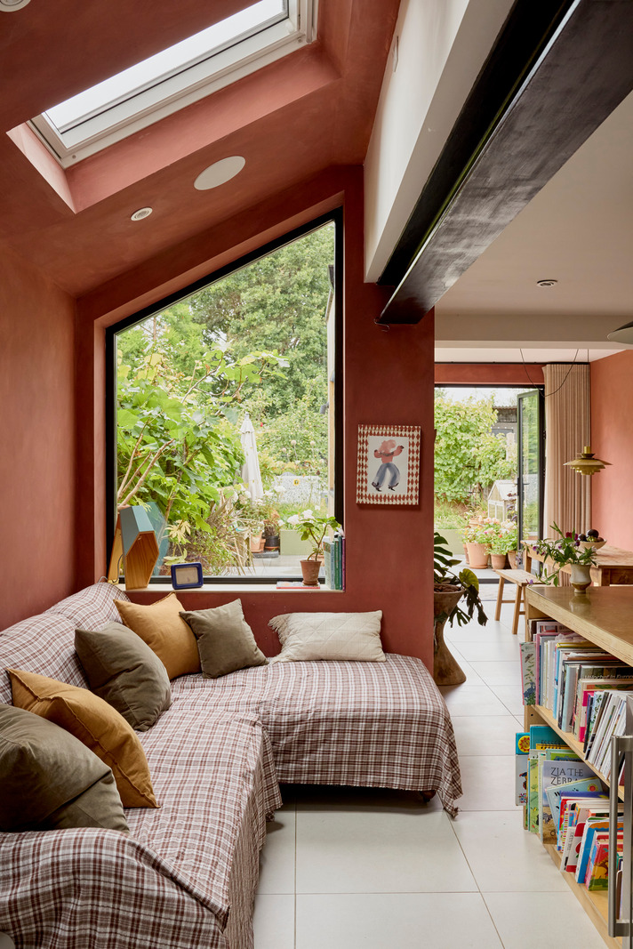 kitchen family room with red brick colour walls in a contemporary extension Victorian house Greater London