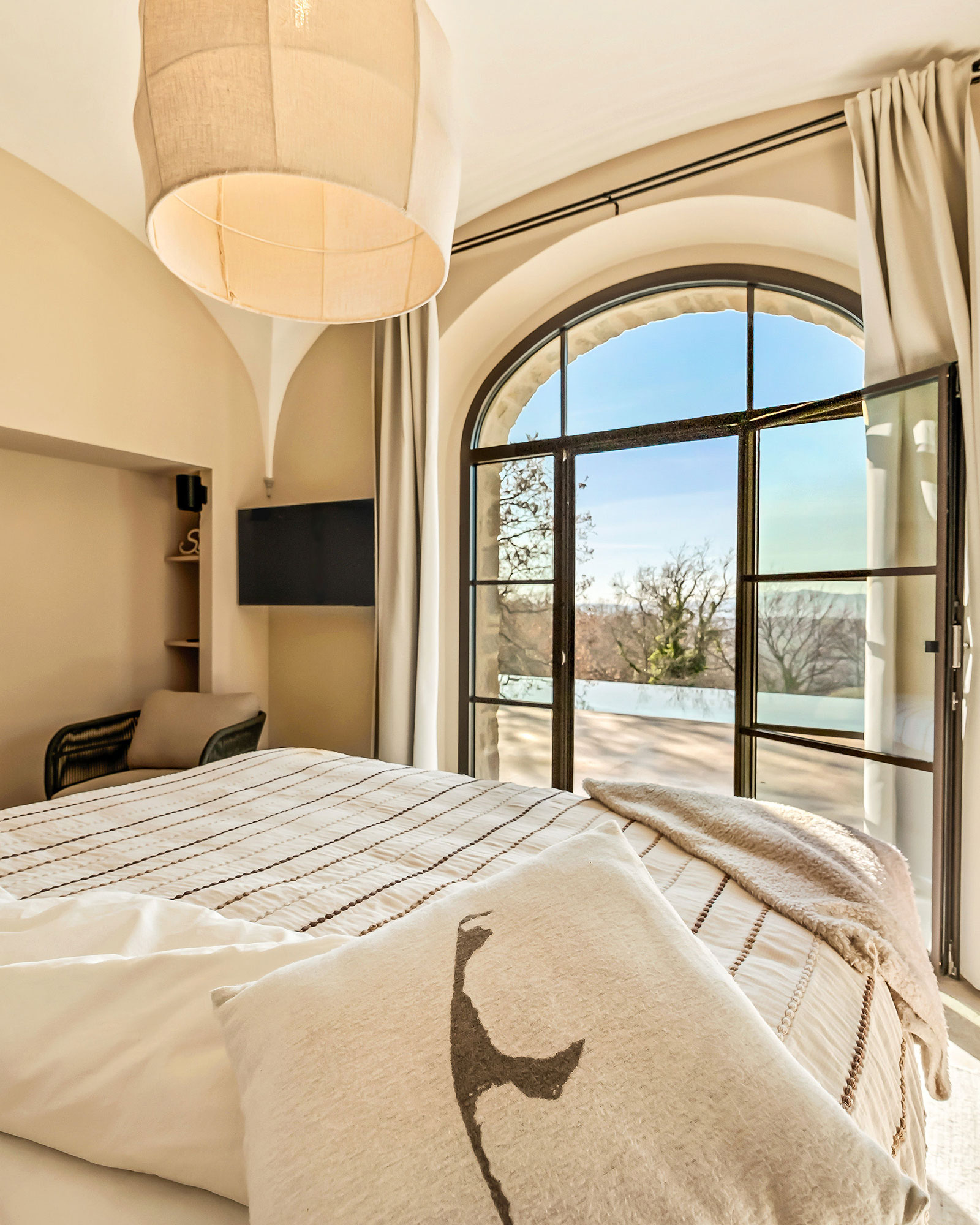 bedroom with arched window La Torre Umbria