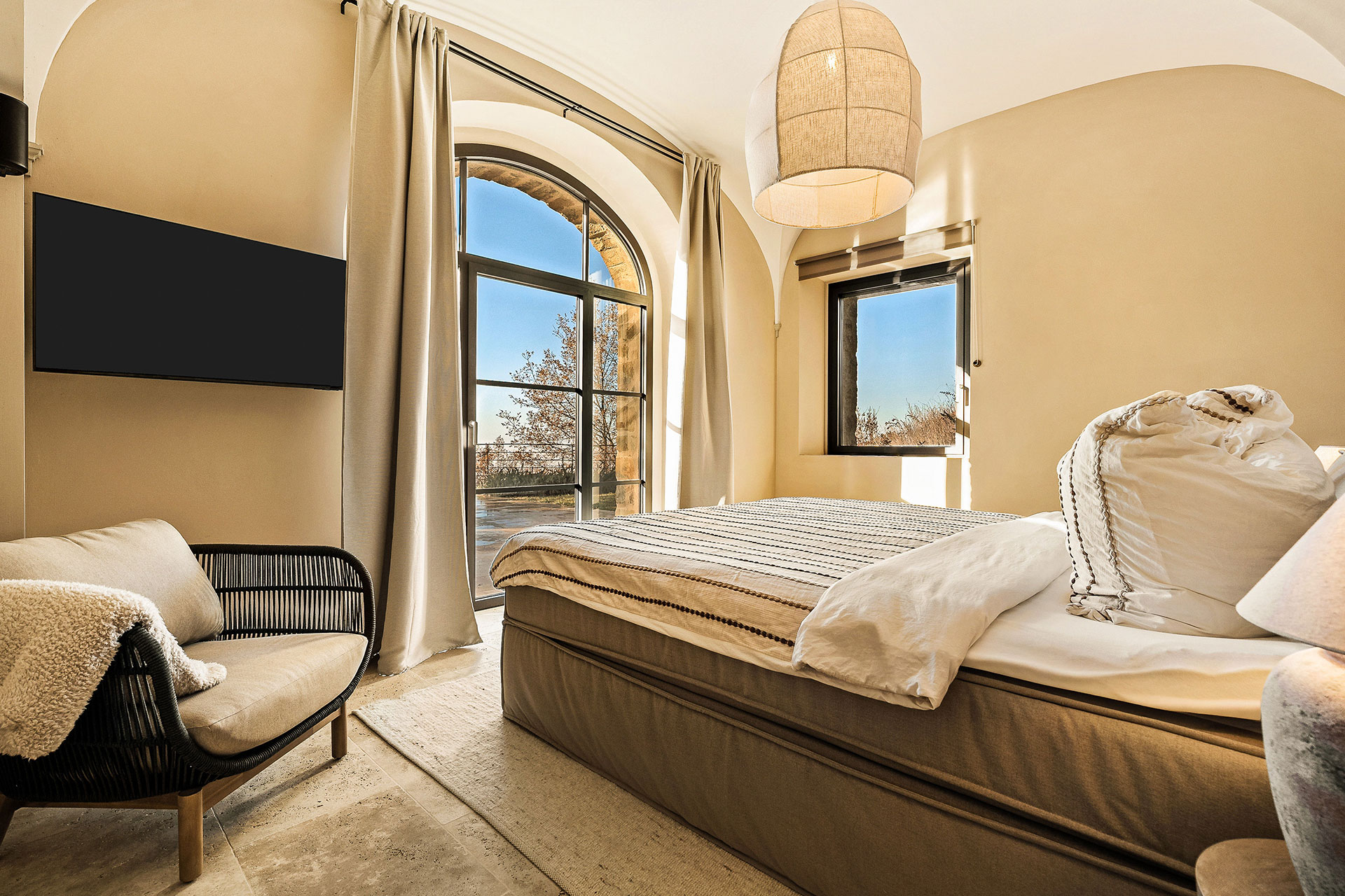 bedroom with arched window La Torre Umbria