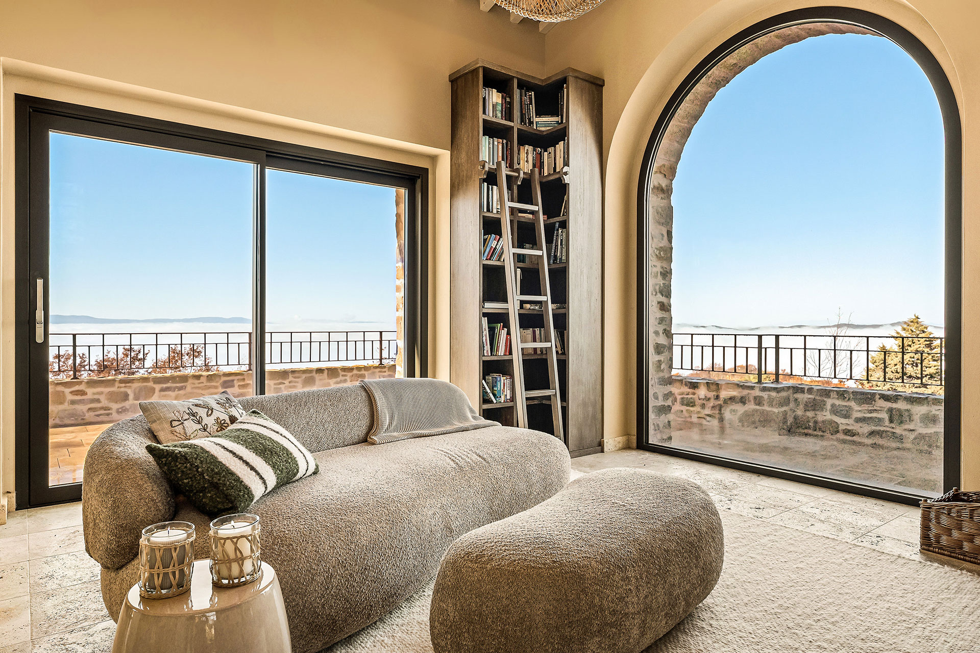 living room with arched window stone house with pool La Torre Umbria designer decor