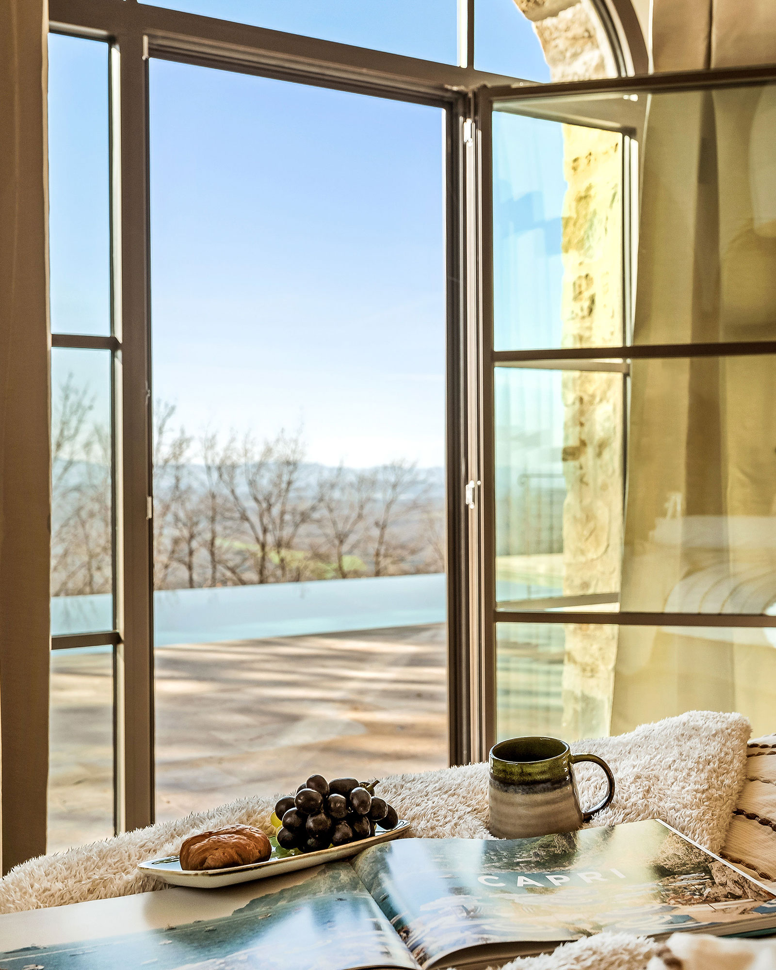 bedroom with arched window La Torre Umbria