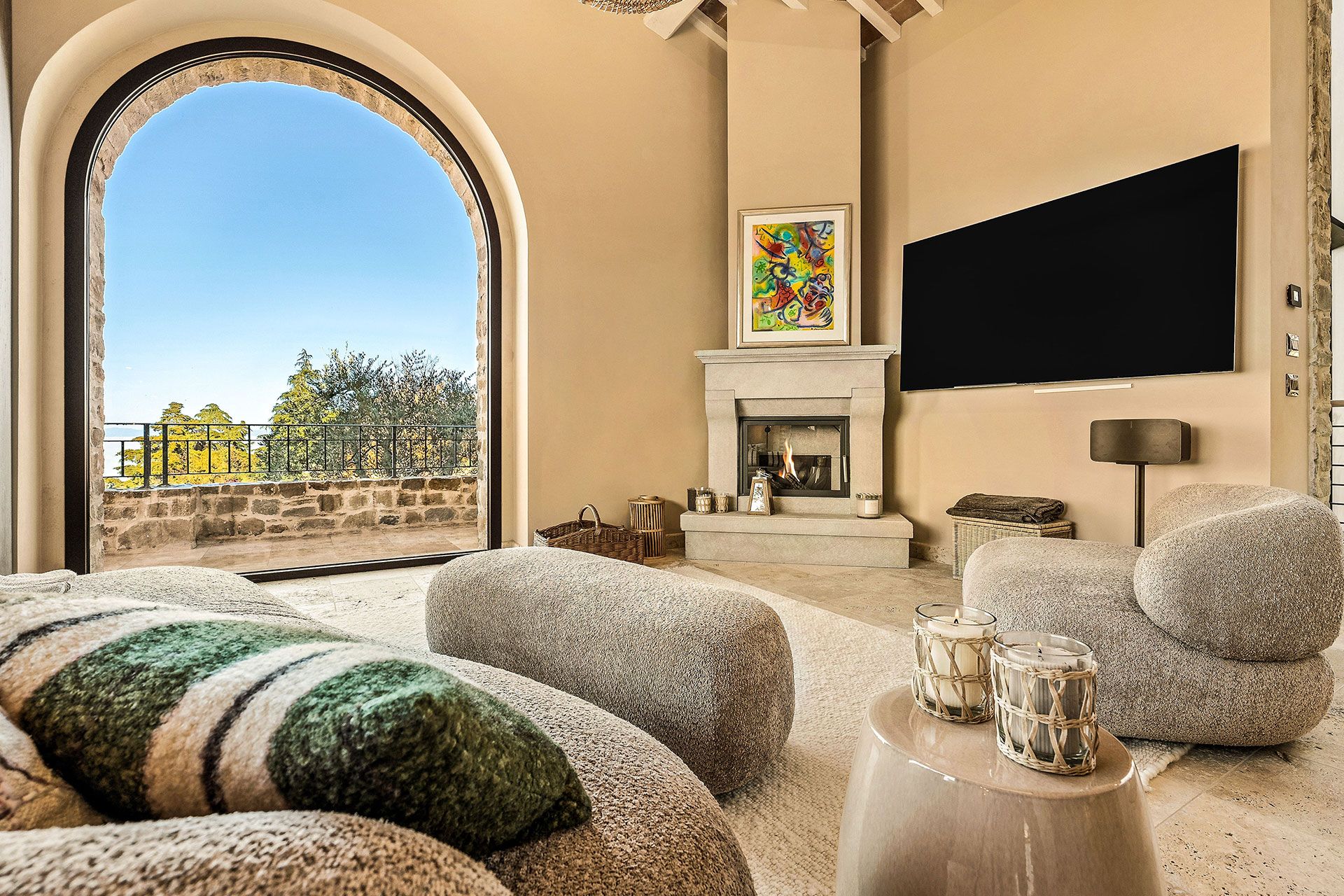 living room with arched window stone house with pool La Torre Umbria designer decor