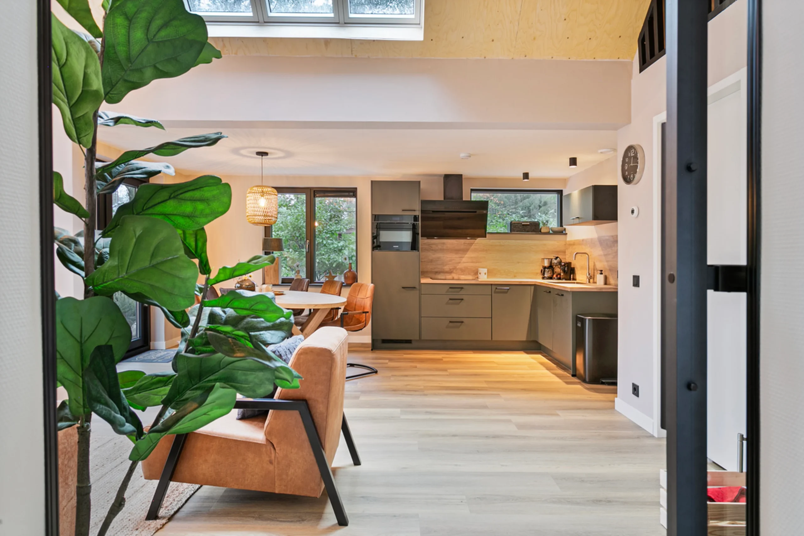 kitchen and living room modern wooden house with lush garden Netherlands kitchen and living room modern wooden house with lush garden Netherlands