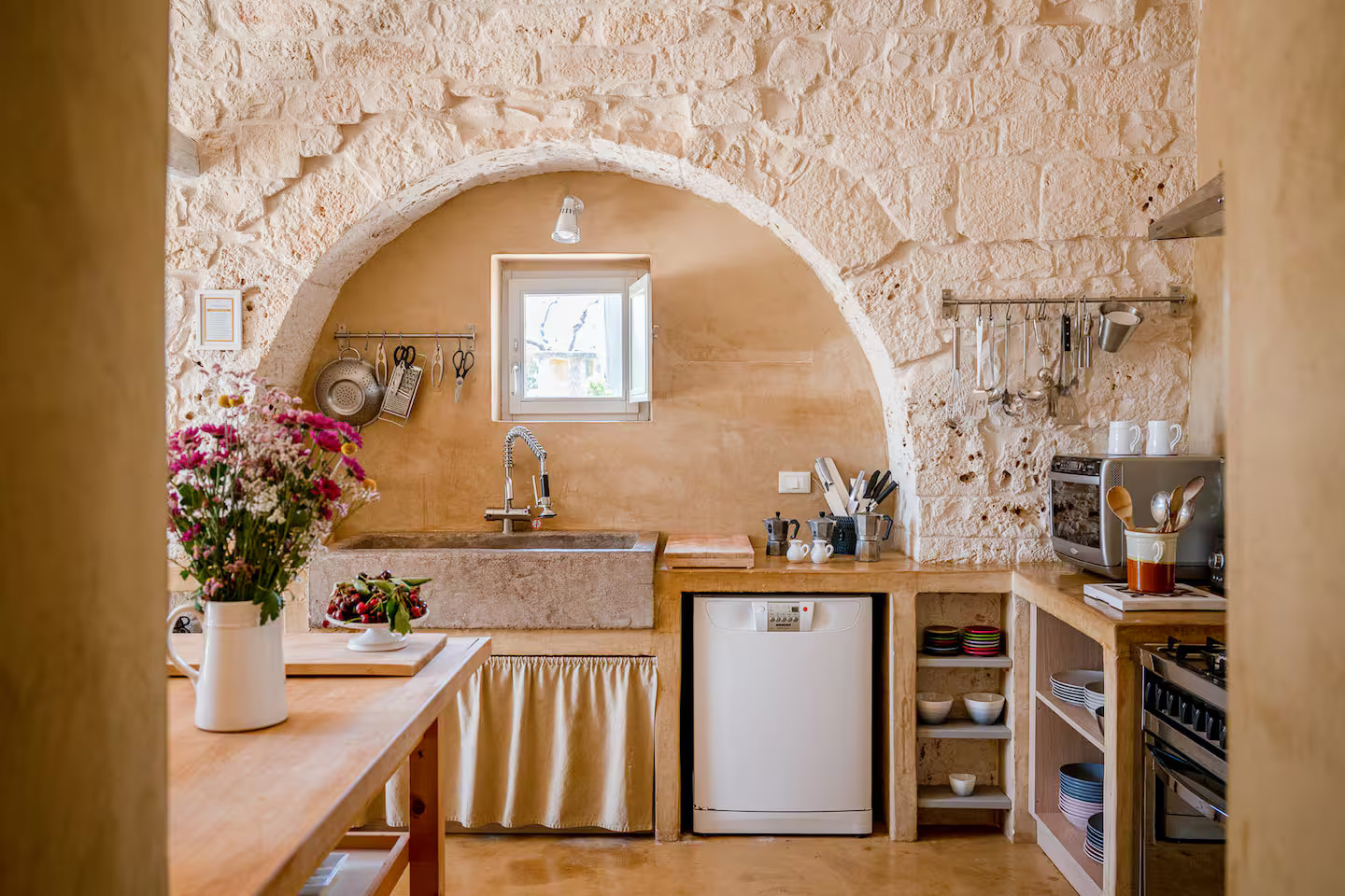 kitchen with archs and stone walls Villa Coki
