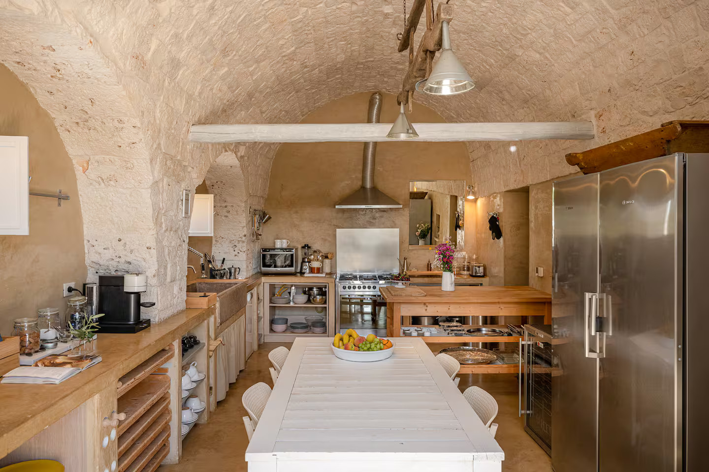 kitchen with archs and stone walls Villa Coki
