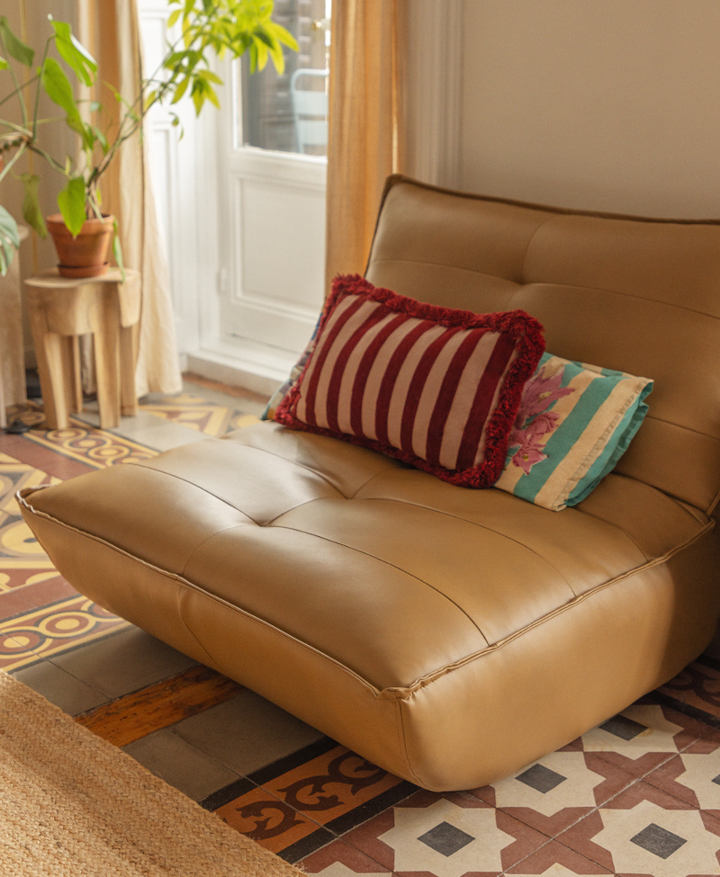 Stylist Helena Cuesta's seemingly simple home in Spain living room with fireplace and period cement tiles furnished by Sklum classic chic decor 