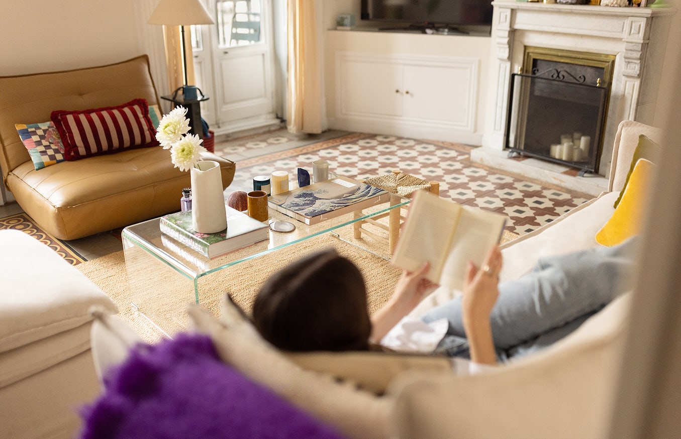 Stylist Helena Cuesta's seemingly simple home in Spain living room with fireplace and period cement tiles furnished by Sklum classic chic decor 