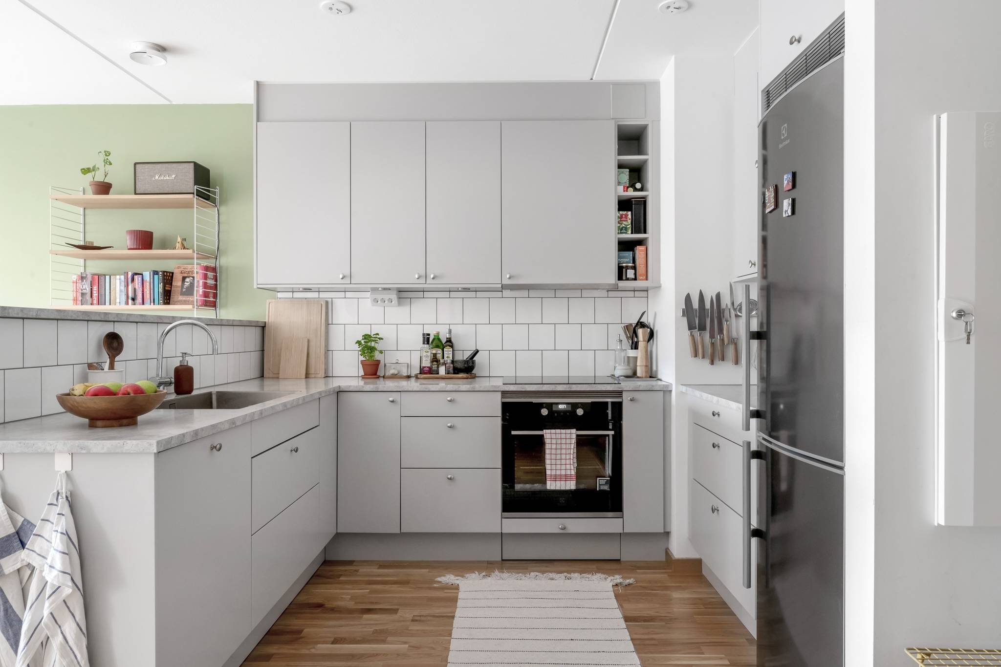 semi open kitchen and living room with a green wall scandinavian decor 41sqm one-bedroom apartment semi open kitchen and living room with a green wall scandinavian decor 41sqm one-bedroom apartment