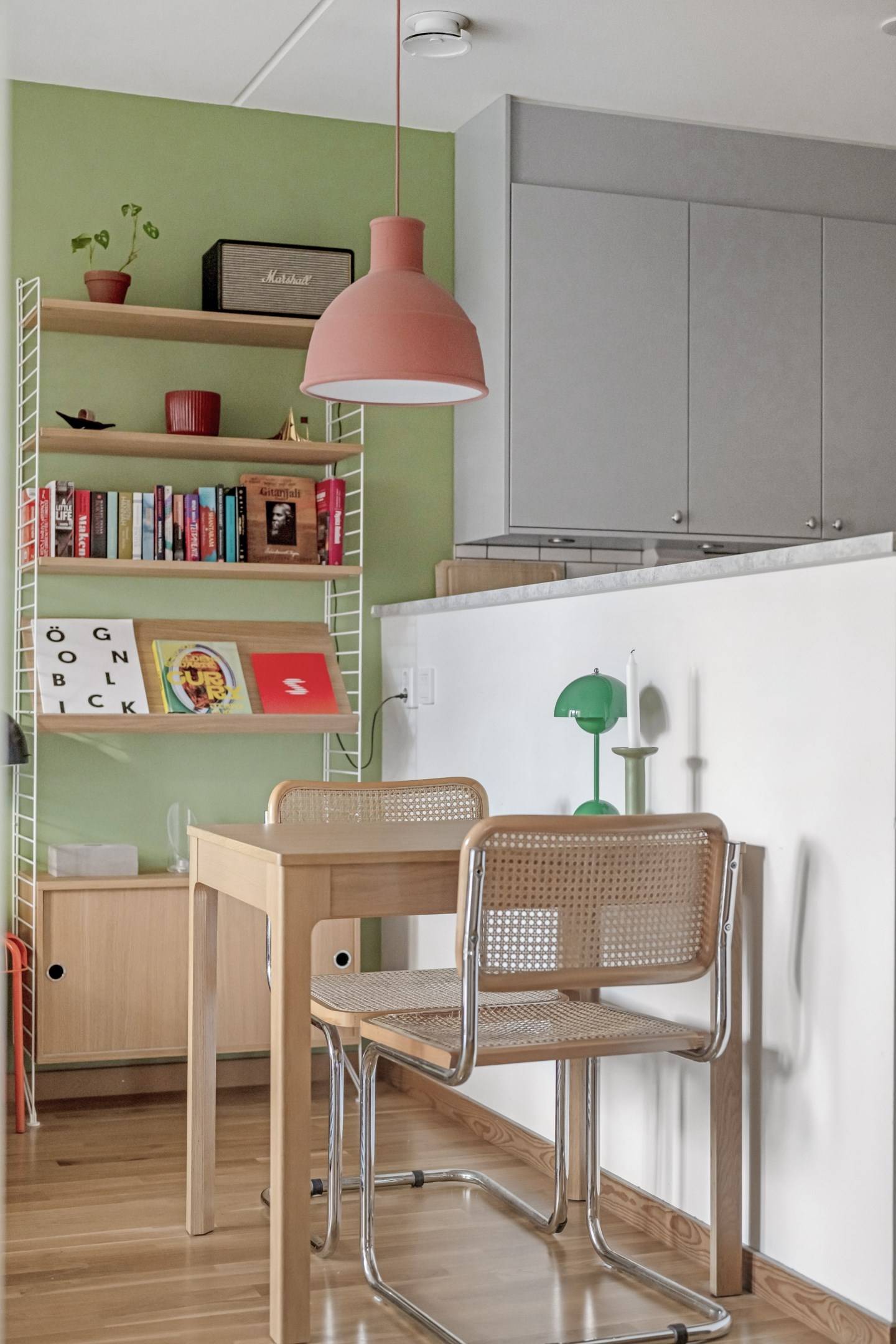 living room and dining room with a green wall scandinavian decor 41sqm one-bedroom apartment with String bookcase living room and dining room with a green wall scandinavian decor 41sqm one-bedroom apartment with String bookcase