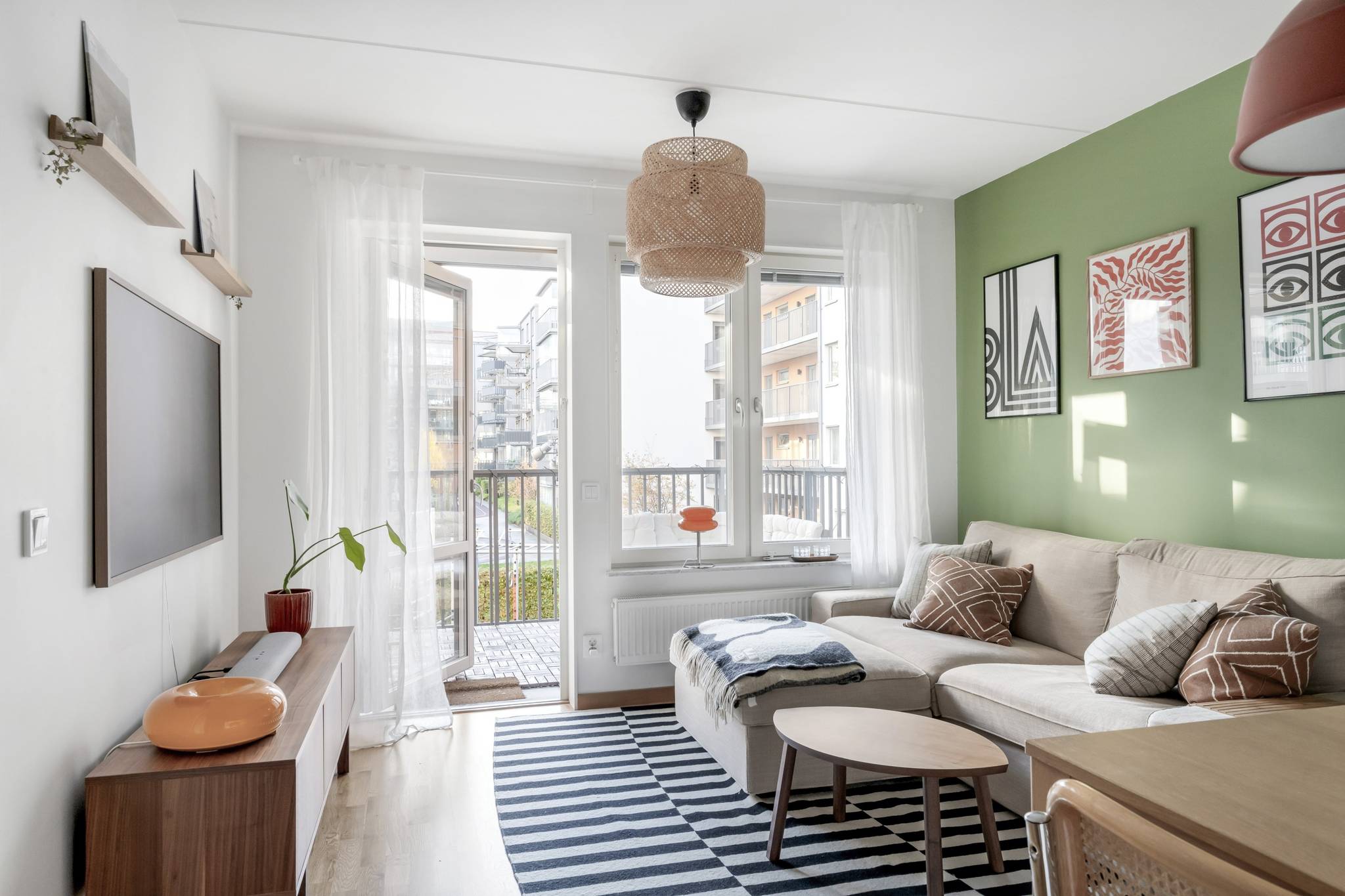 living room and dining room with a green wall scandinavian decor 41sqm one-bedroom apartment with balcony living room and dining room with a green wall scandinavian decor 41sqm one-bedroom apartment with balcony