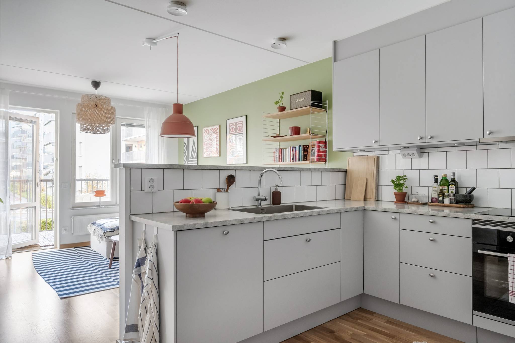 semi open kitchen and living room with a green wall scandinavian decor 41sqm one-bedroom apartment semi open kitchen and living room with a green wall scandinavian decor 41sqm one-bedroom apartment