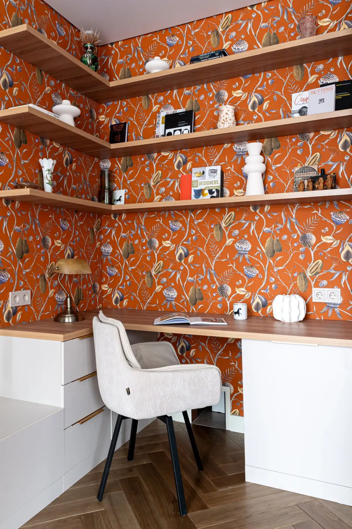 home office with orange botanical wallpaper