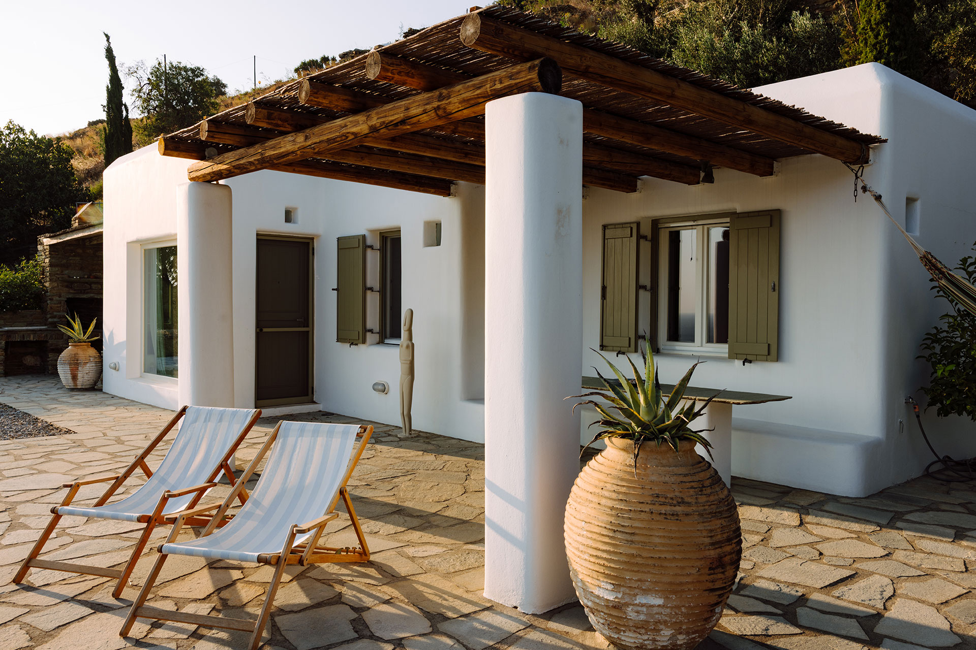 terrace with pergola minimalist house with pool Villa Rizza island of Andros Greece