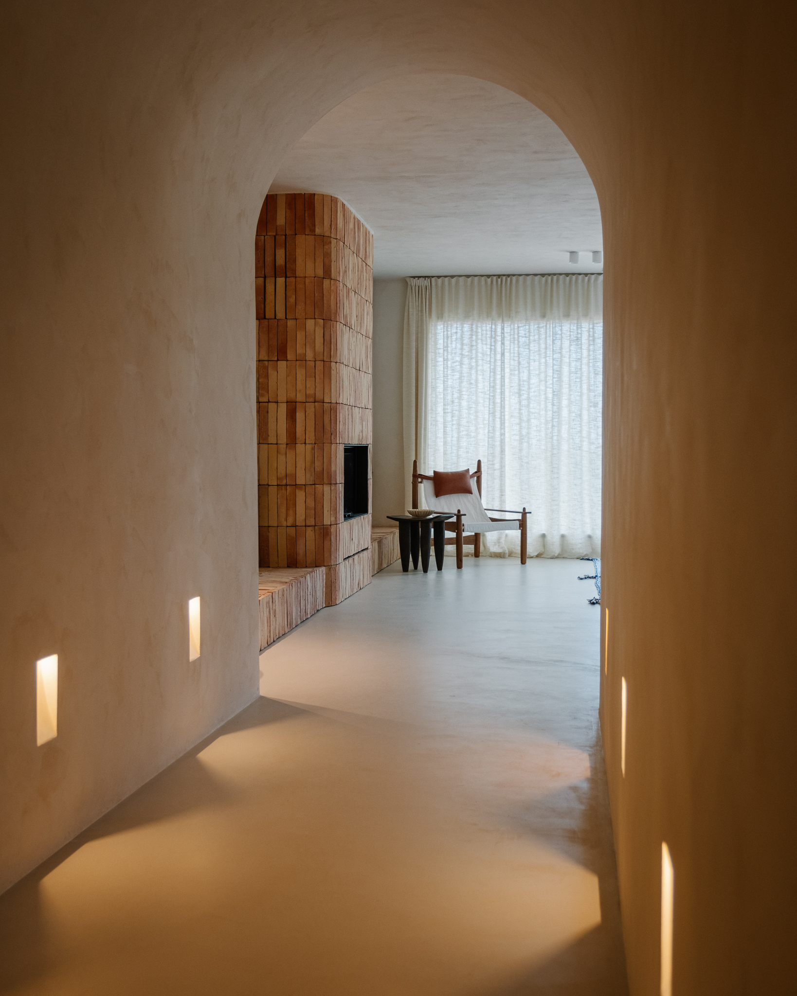 entryway and living room natural tones withe fireplace