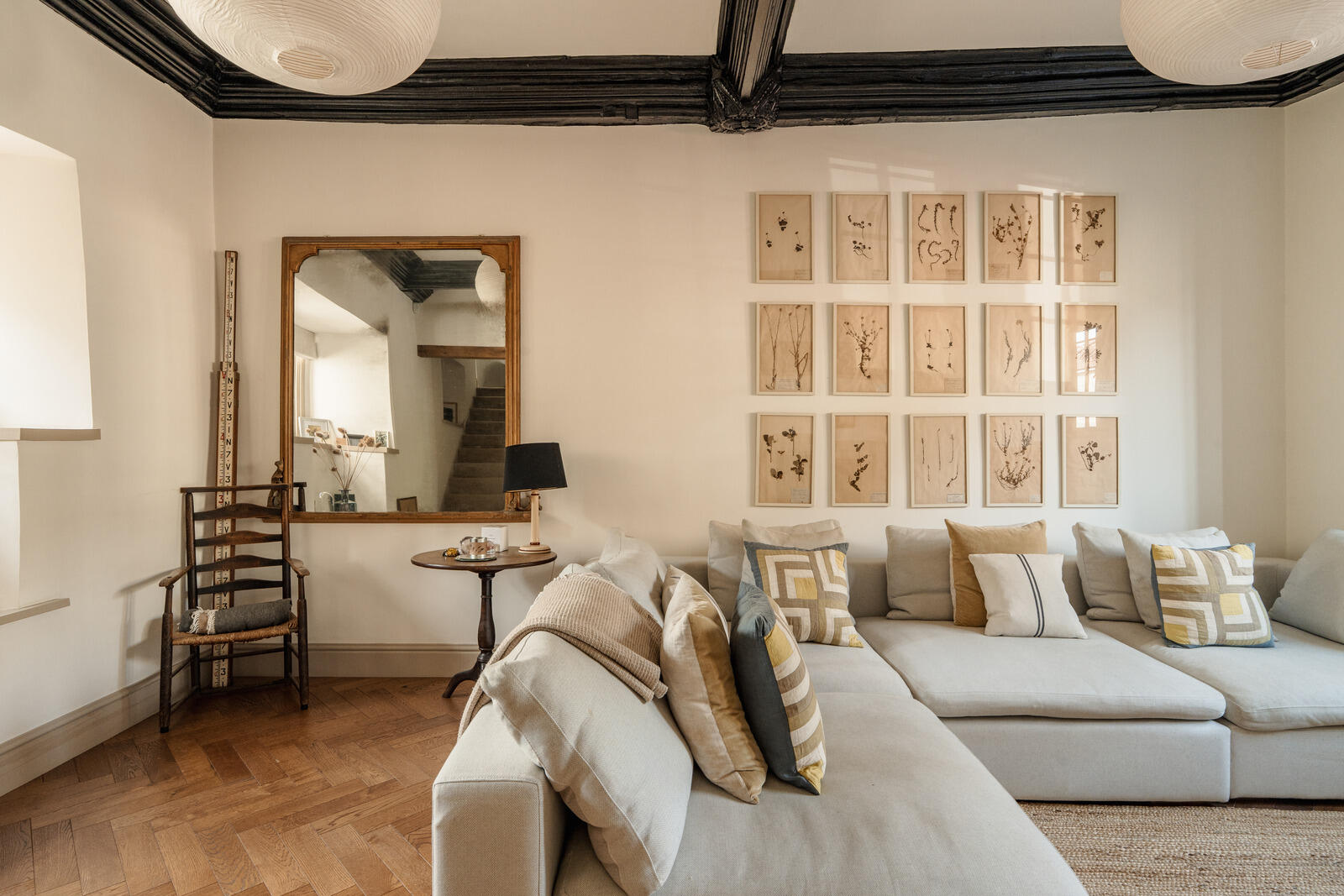 beige living room with fireplace and beams classic chic decor Tudor-style village house