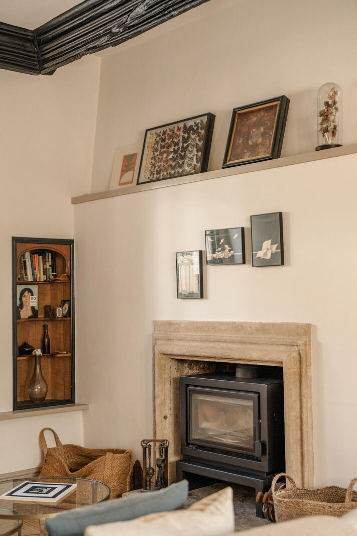 beige living room with fireplace and beams classic chic decor Tudor-style village house